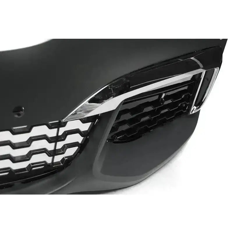 Frontbumper BMW G11/G12 M-Tech Style nærbilde med bikakegrill og kromdetaljer på sort, glanset overflate.