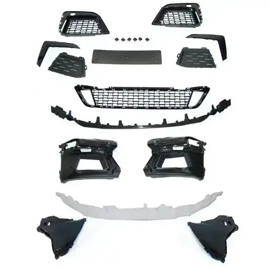 Front bumper sett til BMW G30 G31 LCI med sorte og grå plastdeler vist fra oven på hvit bakgrunn.