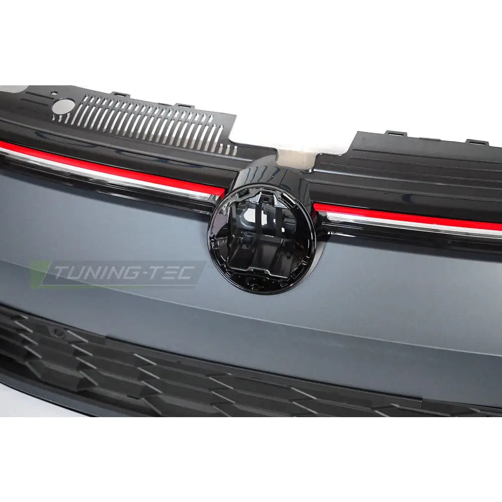 Frontbumper for Volkswagen Golf 8 sport med sort grill, rød linje og rundt emblemfeste uten logo.