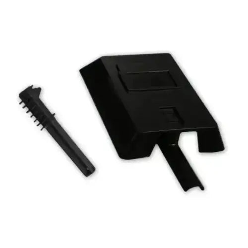 Sort plastkomponent til sveiseinverter med medfølgende kort børste, fotografert fra skrå vinkel på hvit bakgrunn.