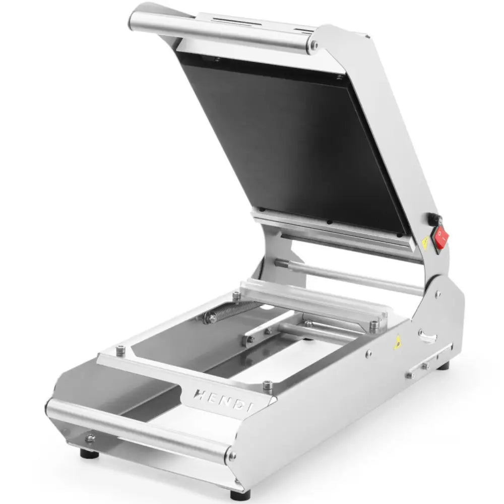 Sveisemaskin for brett og kopper, åpent lokk, sort varmeplate og rød bryter synlig fra siden.