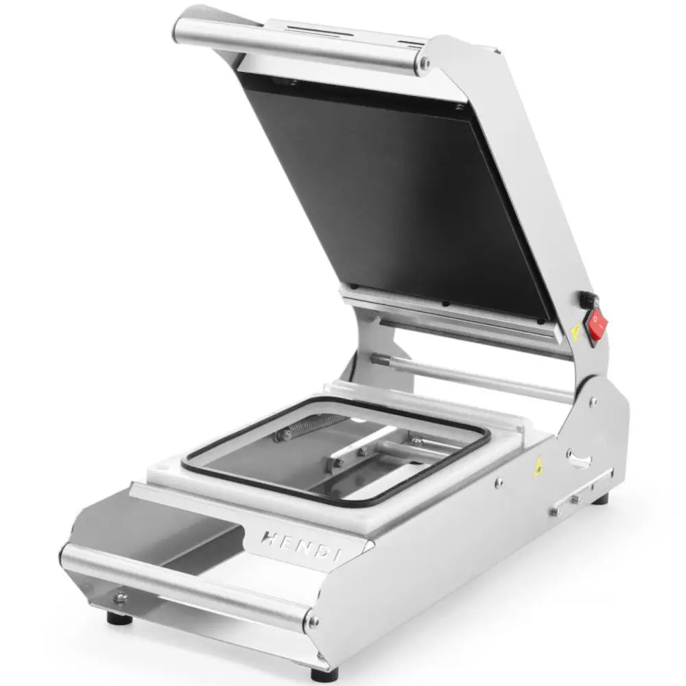 Sveisemaskin for brett og kopper, skråvinklet visning med åpent lokk, synlig innside og rød av/på-bryter.