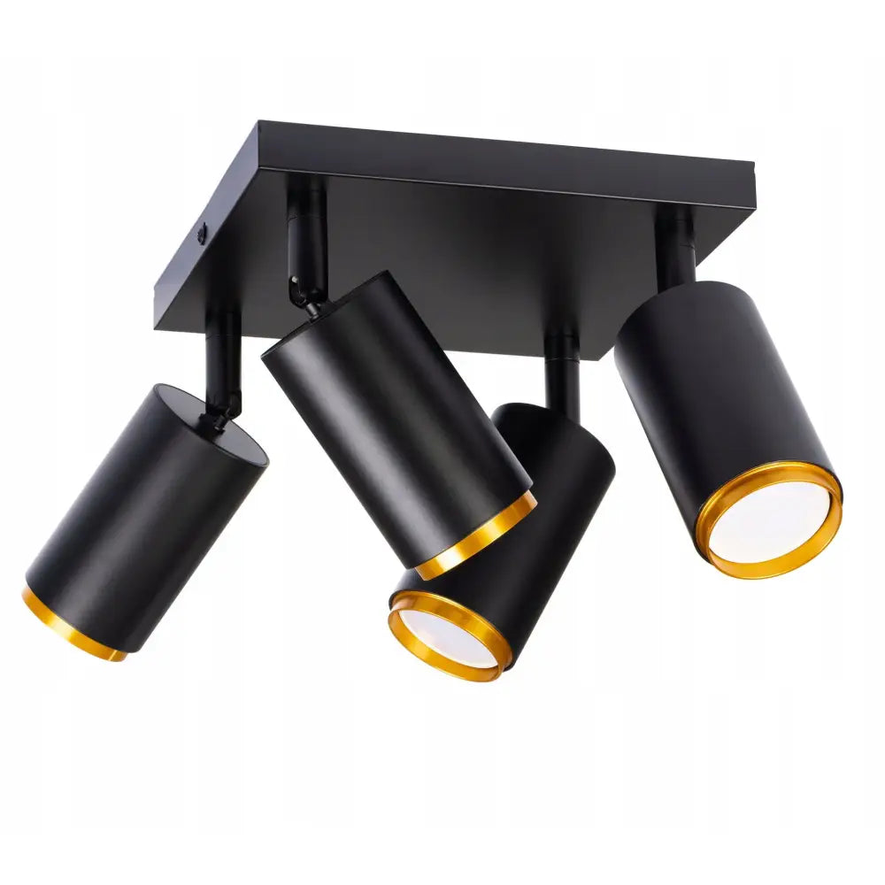 Taklampe Spot Light med fire svarte sylinderspotter og gyllen kant, sett skrått nedenfra mot hvit bakgrunn.