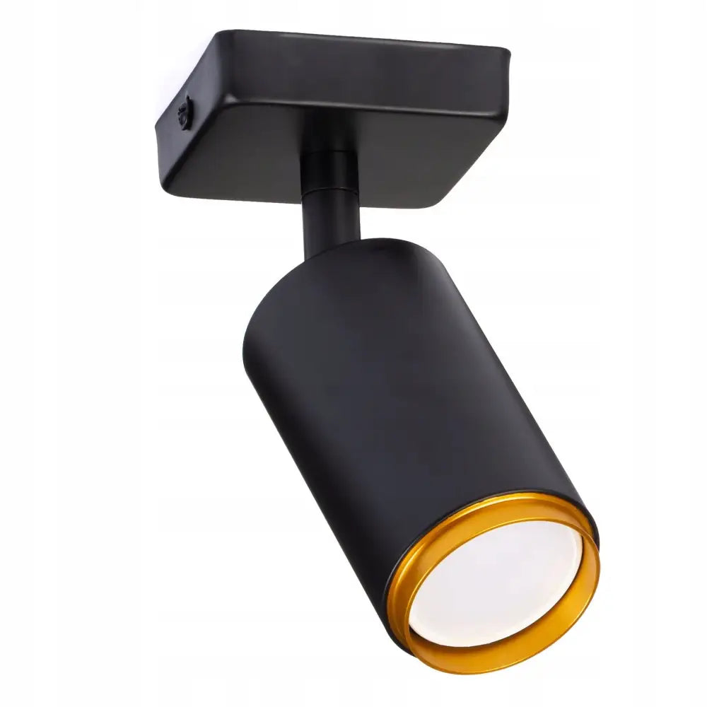 Taklampe Spotlight, svart sylinder med gull innerring og matt overflate, sett nedenfra med firkantet takfeste.