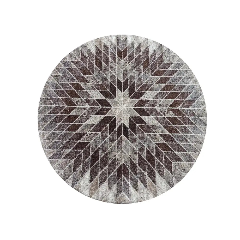 Tepe beige rundt teppe 160 cm med geometrisk stjernemønster i grå og brunt, patchwork-design sett ovenfra.