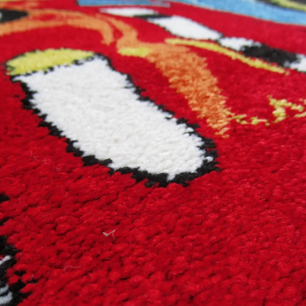 Tepe Bella 06 mørkeblå teppe, nærbilde av tykk lugg med fargerike detaljer og tydelig tekstur.