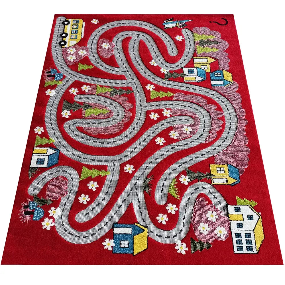 Tepe Color Kids leketeppe i rødt, sett ovenfra med grå bilvei, fargerike hus og grønne trær.