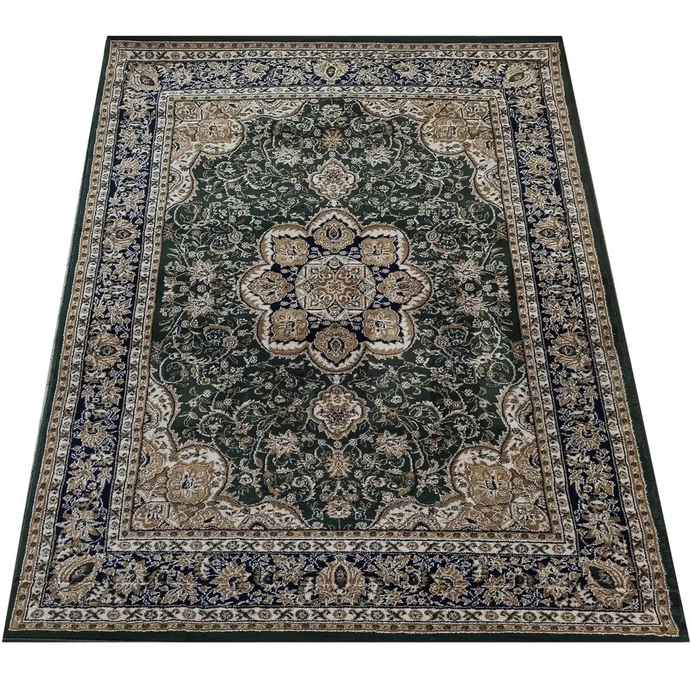 Tepe Eksklusiv 03 N, rektangulært teppe med orientalsk mønster i mørkegrønt, beige og blått, sett fra skrå vinkel.