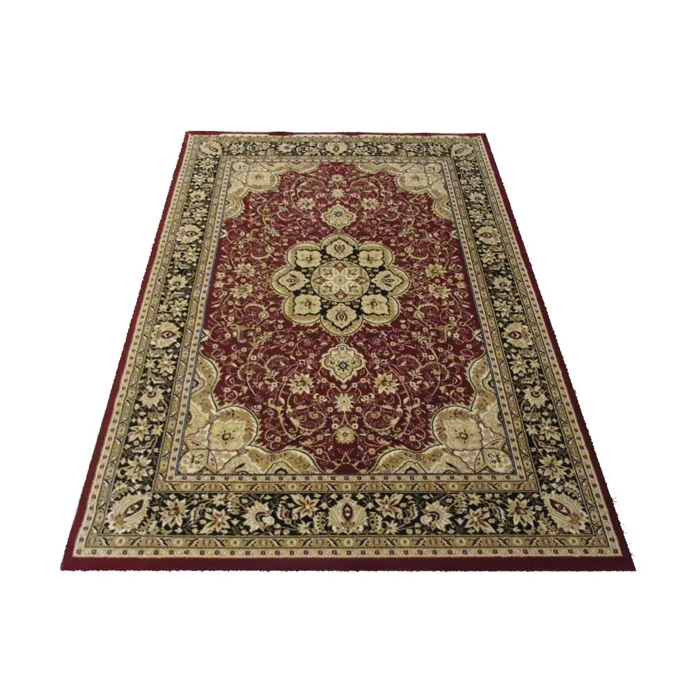 Tepe Eksklusiv teppe i rødt med orientalsk mønster, beige og sorte detaljer, sett skrått ovenfra.