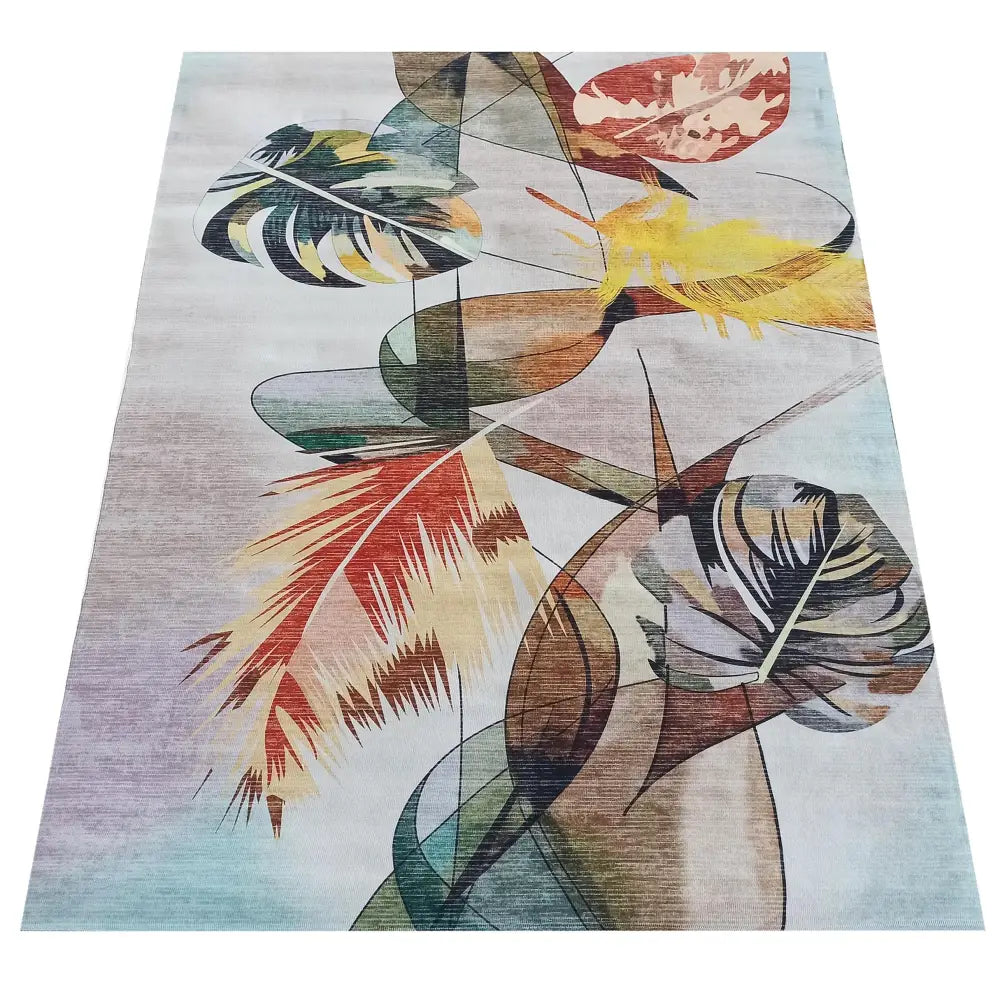 Teppe for Horeca-næringen, beige med abstrakt bladmotiv i gult, grønt og rødt, skrå oversiktsvinkel.