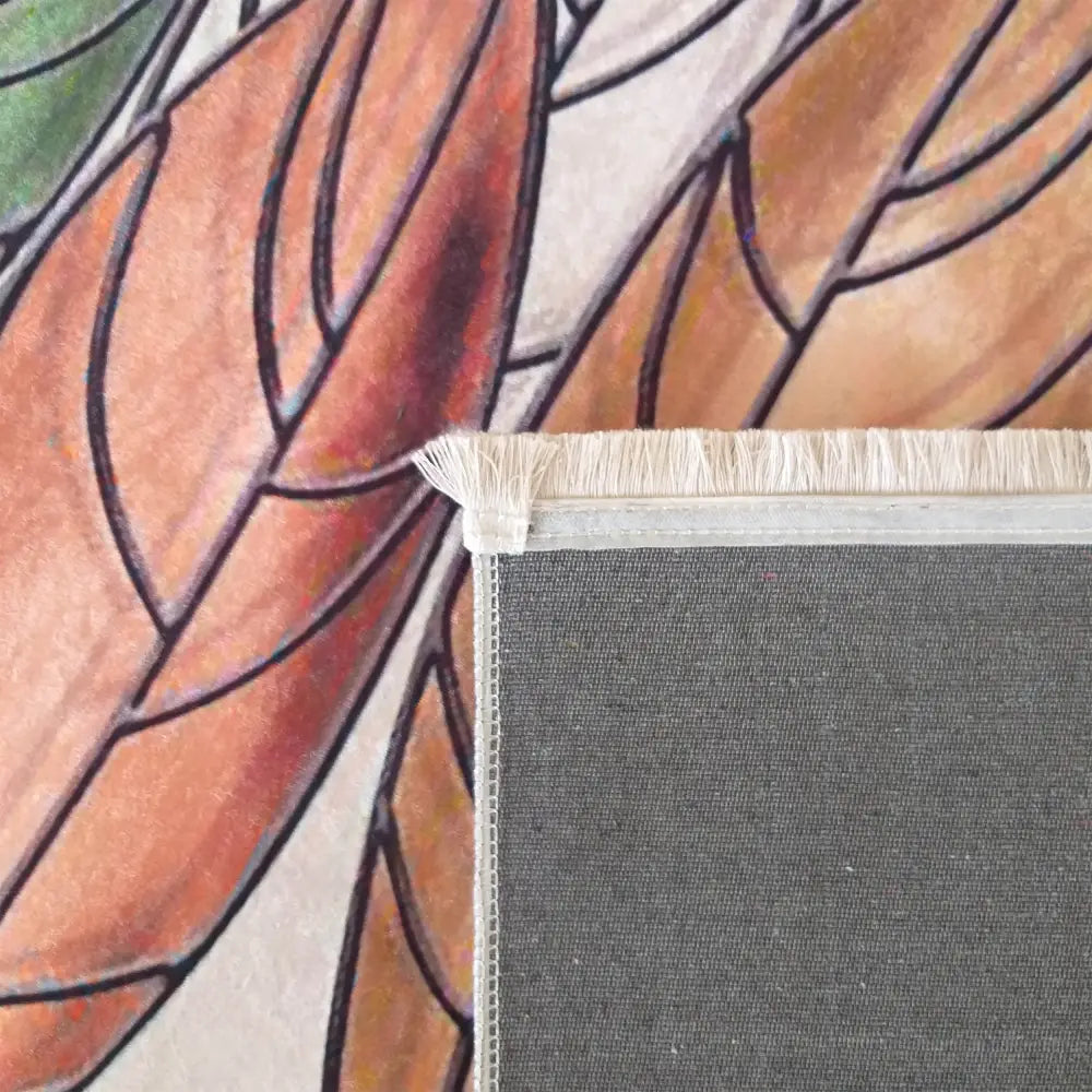 Tepe Horeca-Ny 102 beige pledd, detalj av hjørne med frynsekant og grå bakside mot bladdekor.