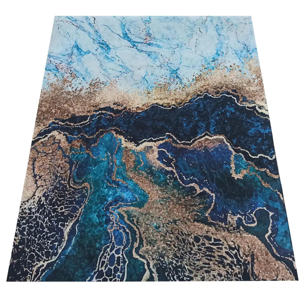 Tepe Horeca-Nytt blått teppe 160 x 220 cm, sett ovenfra med marmorinspirert mønster i blått og beige.