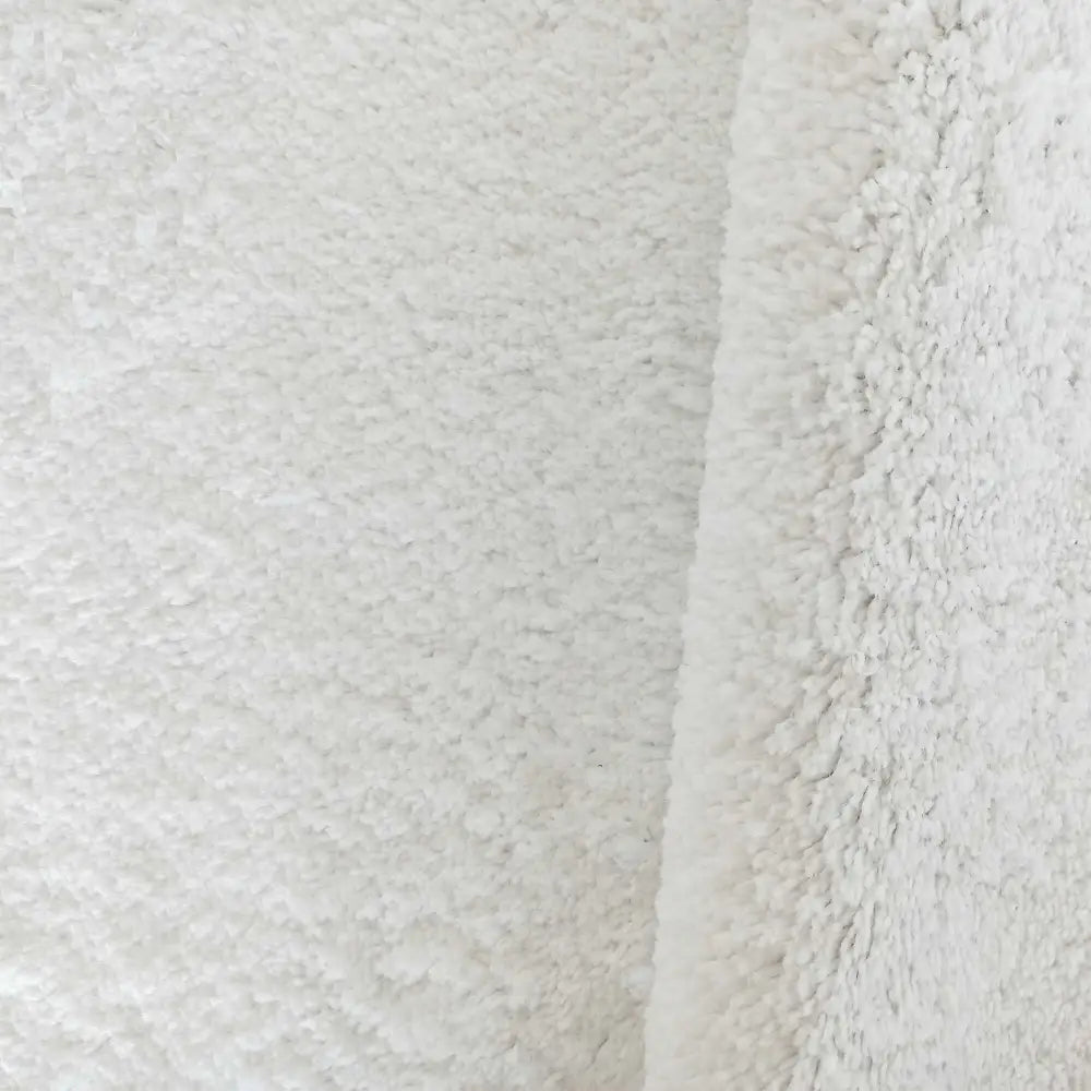 Tepe Kamel hvitt tekstil, detaljert nærbilde av loddent materiale i brettet vinkel på 160 x 220 cm.