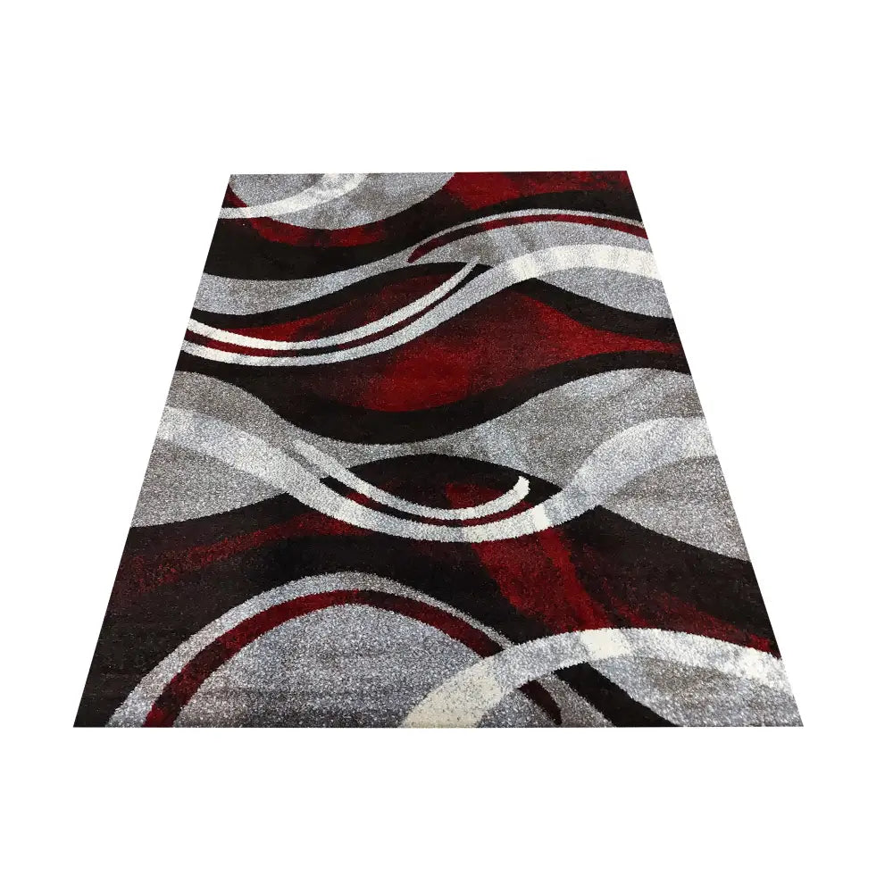 Tepe Otto 01 teppe i grått og rødt, skrått sett ovenfra med bølgende abstrakt mønster i flere farger.