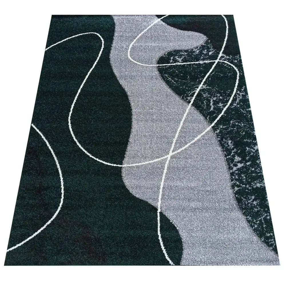 Tepe Otto teppe i grågrønn, rektangulært med abstrakt svart, grått og hvitt mønster sett ovenfra.
