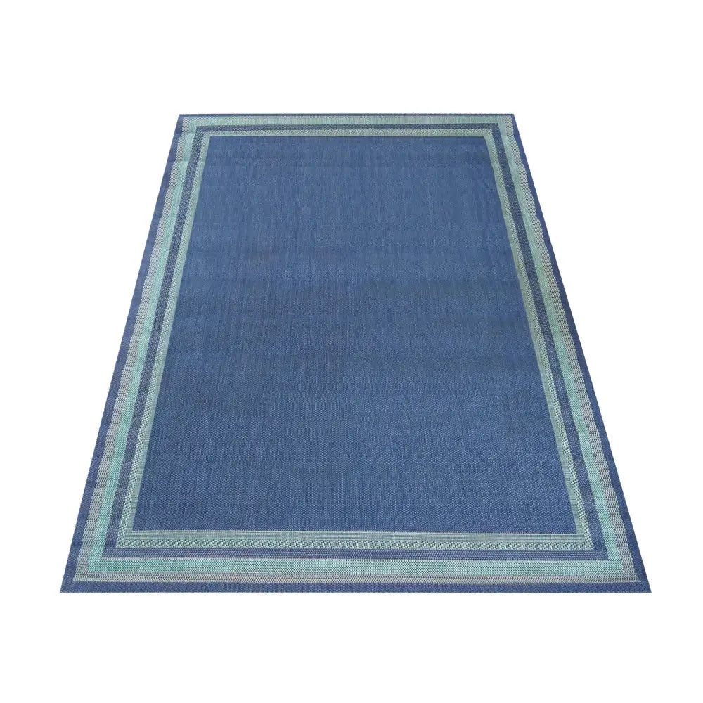 Tepe Patio 12 Marine teppe, blått med lyseblå og grønne border, sett ovenfra mot hvit bakgrunn.