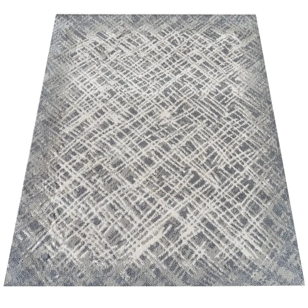 Tepe Roxanne teppe 160 x 220 cm, ovenfra med grått og hvitt abstrakt rutemønster og melert finish.