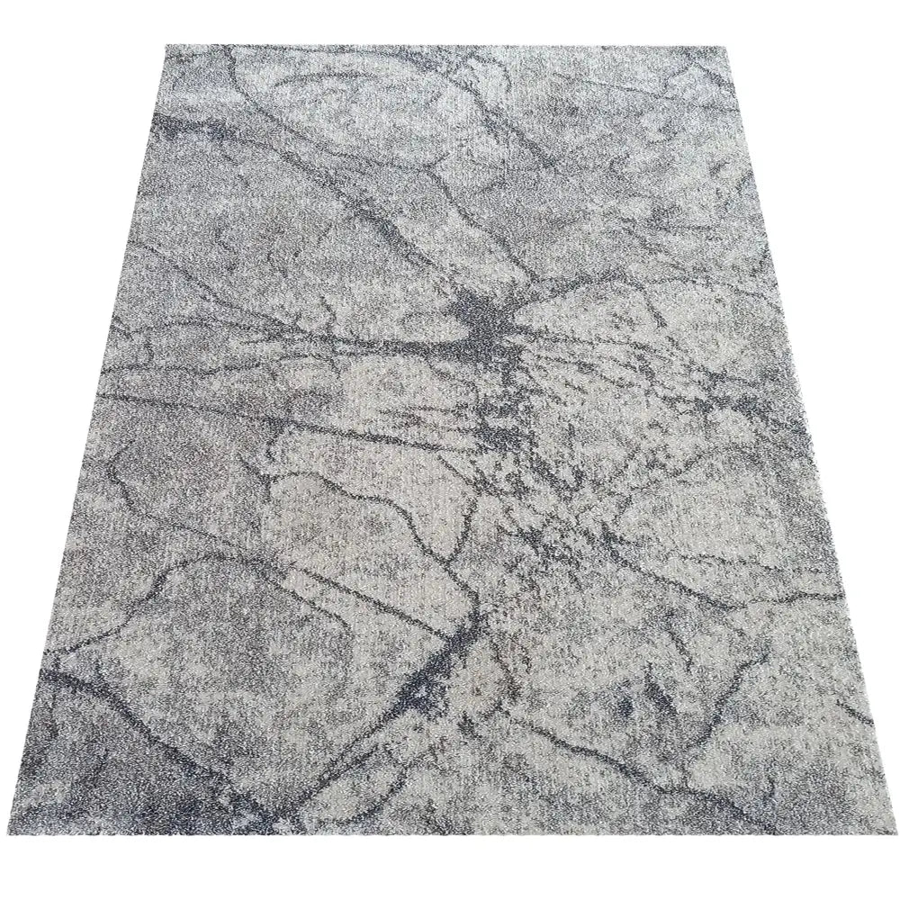 Tepe Vista 08 grått teppe 160 x 220 cm, sett ovenfra med marmorinspirert mønster og myk, tettvevd overflate.