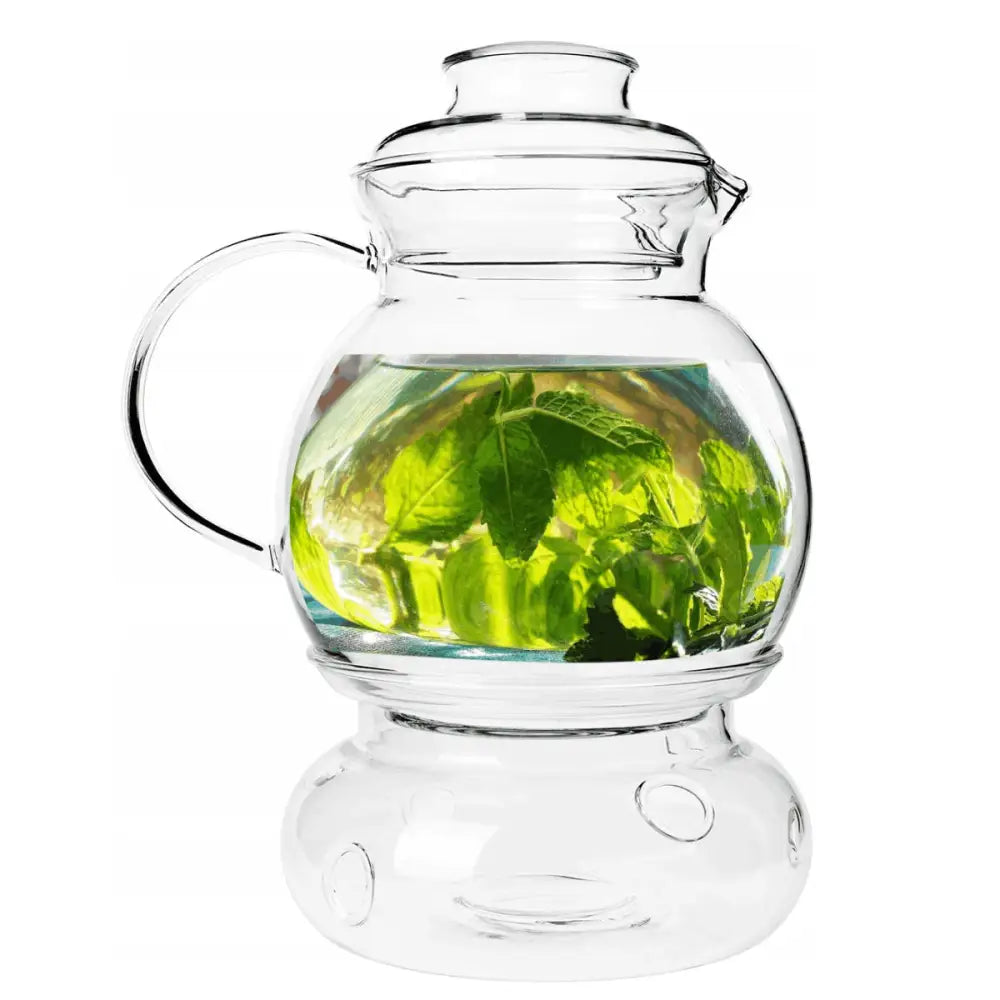 Termokanne med varmeholder til te, glasskanne med mynteblader i vann på matchende glassunderlag.