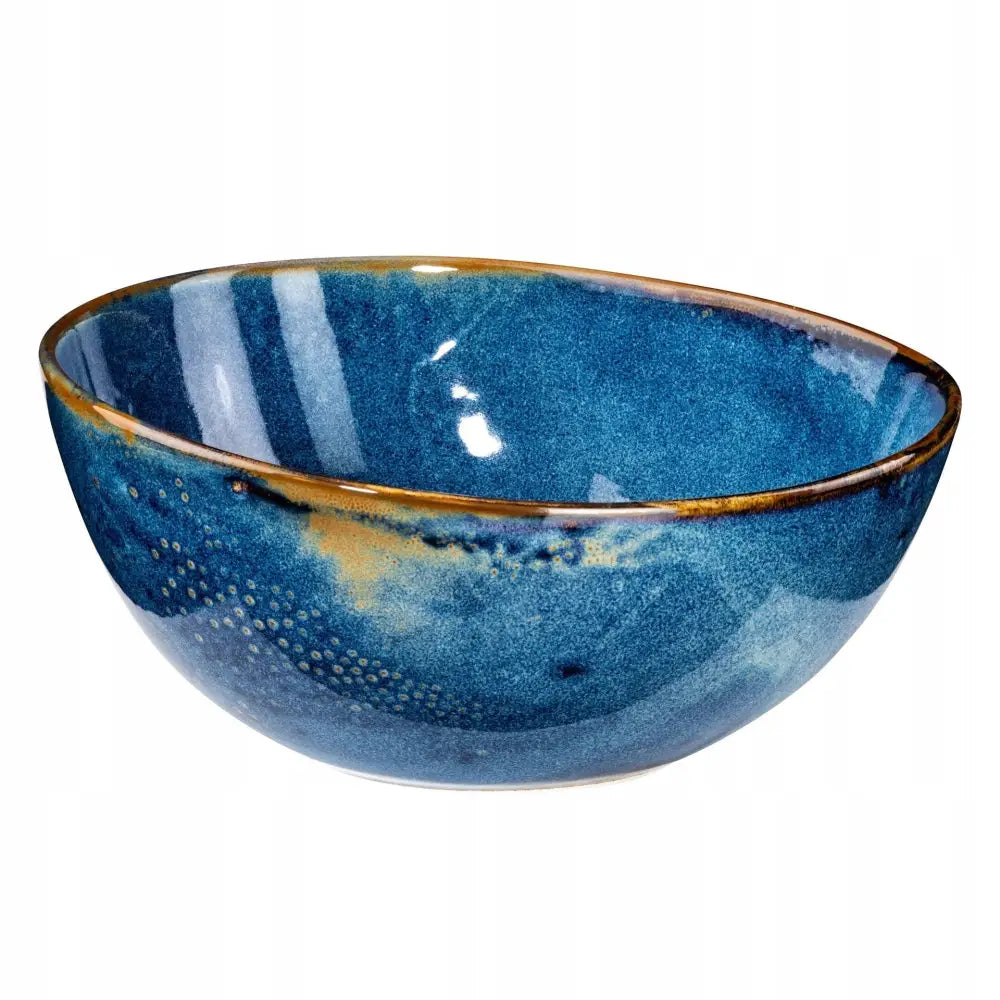 Dyp blå keramisk bolle fra Tom-Gast Misa, skrått sidebilde med turkise nyanser og brune kanter.