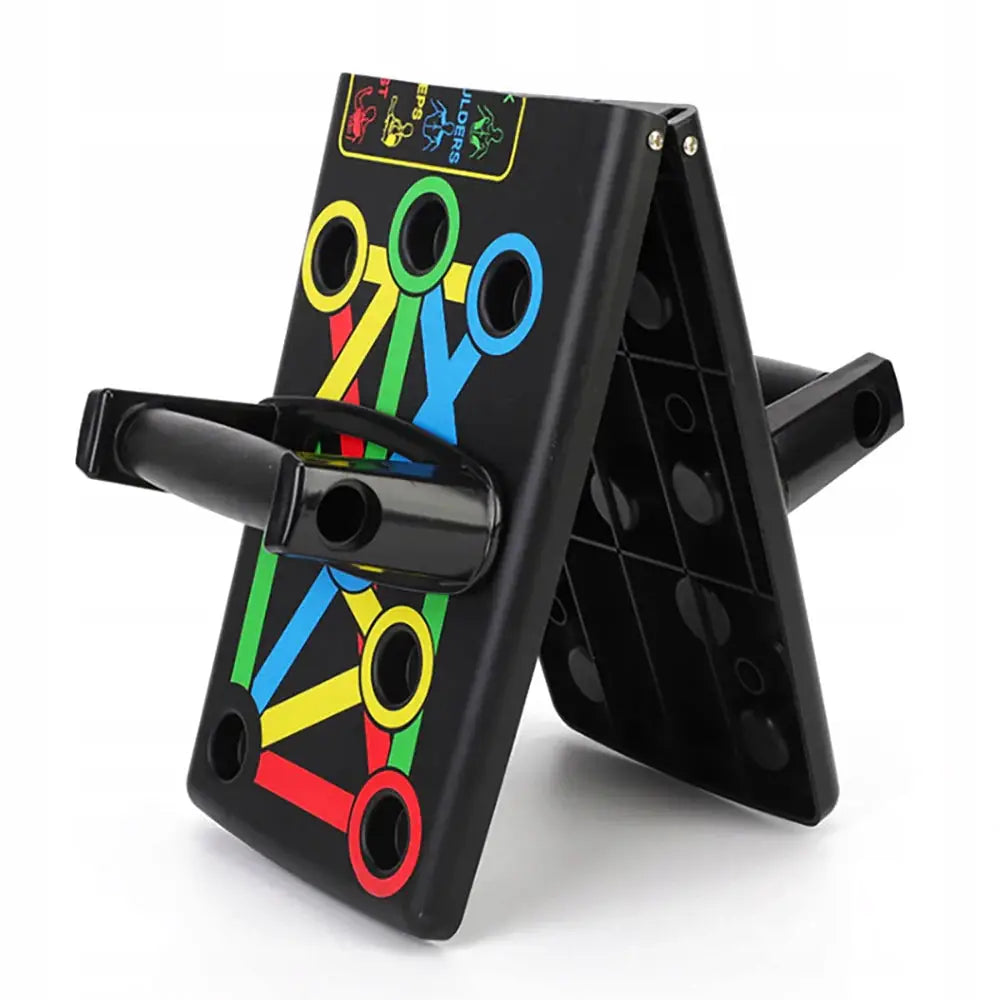 Treningsbrett med håndtak, sort plast med fargede linjer og hull, sett skrått fra siden.