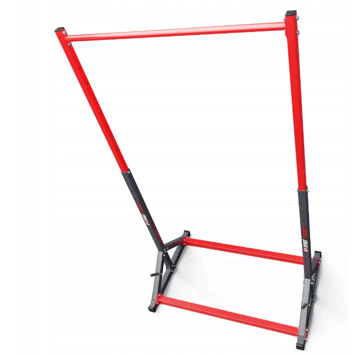 Treningsstang stasjonær, skrå oversiktsvinkel som viser rød og svart metallramme med firkantede rør og synlige bolter.