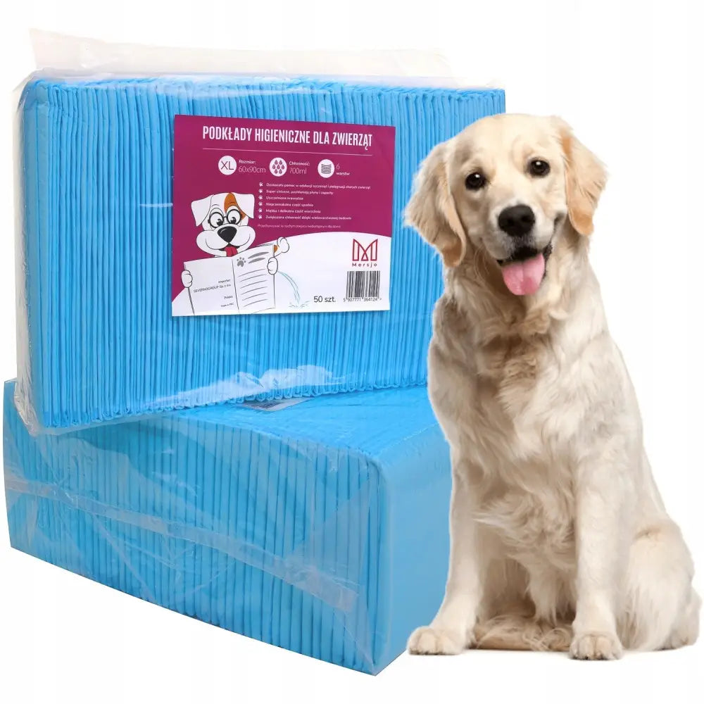 Treningsunderlag Pads for Hund 60x90 cm, 100 stk pakket i plast med glad hund ved siden av pakken.