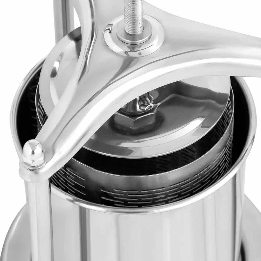 Manuell vinpresse for frukt, nærbilde ovenfra som viser stålnett og rund trykkplate i polert metall.