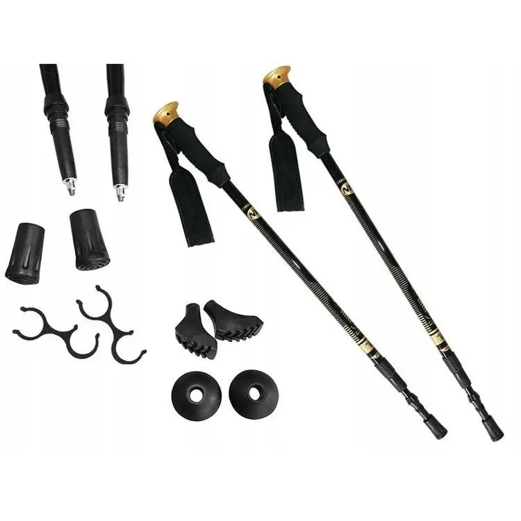 Turstaver Nordic Walking, sammenleggbare svarte staver med gullfargede detaljer og ulike gummiføtter.