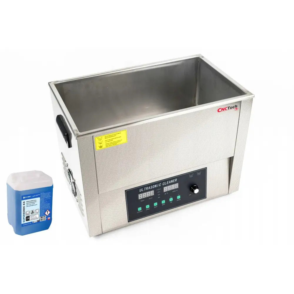 Ultralydvasker 30L i rustfritt stål med digitalt panel, sett fra skrå vinkel, blå rengjøringsvæske ved siden av.