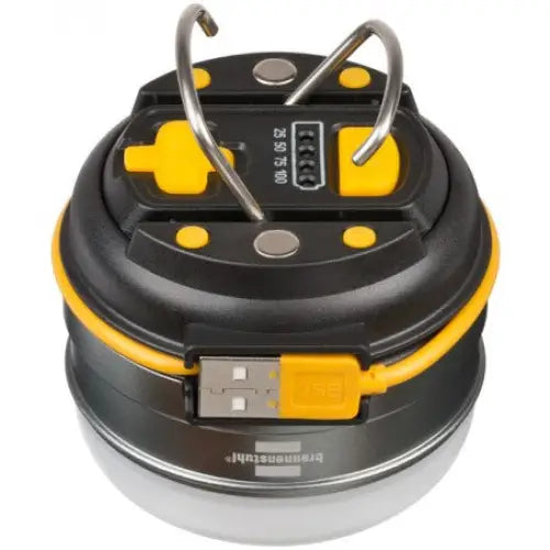 Utendørslampe LED, toppvisning med synlige metallkroker og USB-port med gummihette på sort og gul overflate.
