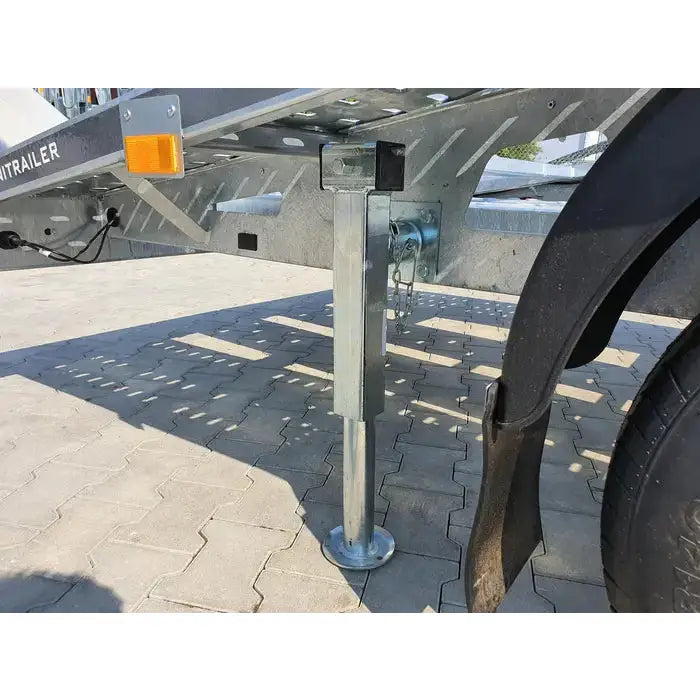 Uttrekkbar støtte for Winterhoff SF 60-19-280, sidevisning med sveiv, låsekjede og brolagt bakgrunn.