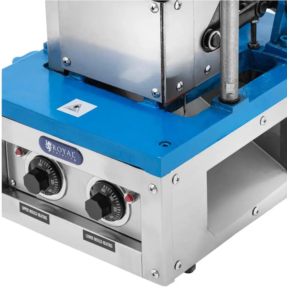 Vaffeljern for isvafler, nærbilde fra skrå vinkel som fremhever blå topp og doble termostatbrytere.