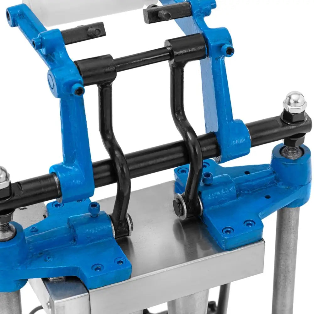 Vaffeljern for iskremkjeks, nærbilde av metallkomponent med blå detaljer og synlige bolter fra skrå vinkel.