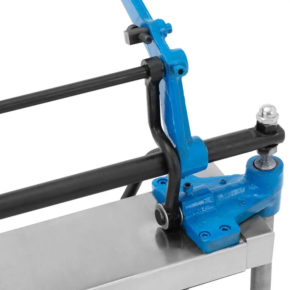 Vaffeljern Iskremkjeks Maskin, nærbilde av leddmekanisme med blå og svarte deler på sølvfarget metallflate.