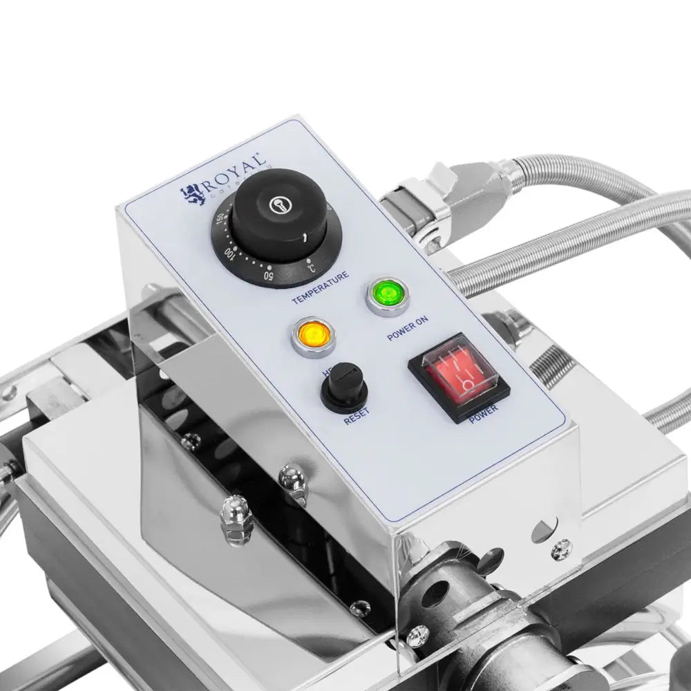 Vaffeljern med roterende plater, detalj av stålpanel med temperaturhjul, lysindikatorer og rød av/på-bryter.