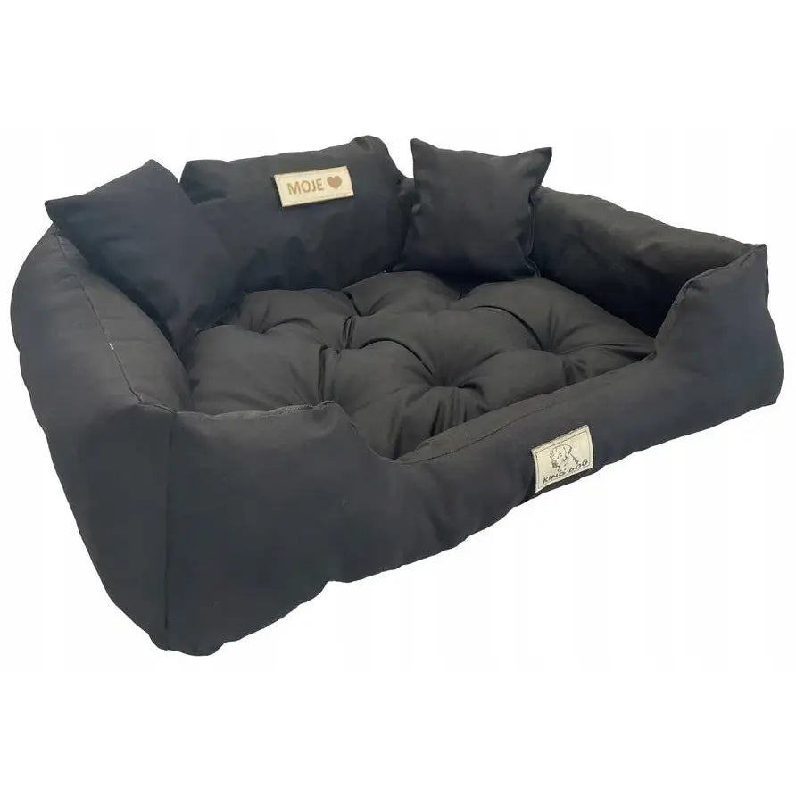 Vannavstøtende mykt hundeseng 100x75, sort seng med høy kant og puter sett fra skrå vinkel.