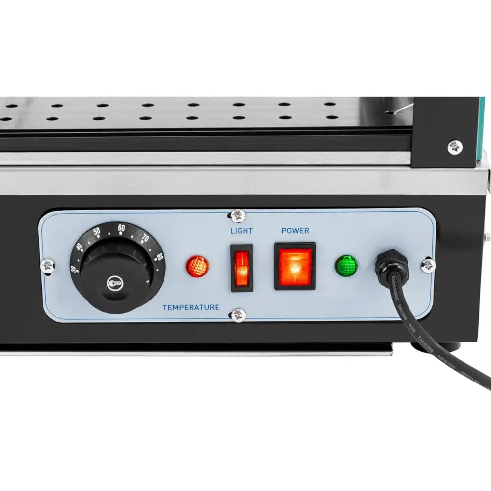 Varmefremvisningsskap kontrollpanel med sort temperaturbryter, lysindikatorer og tilkoblet strømkabel.