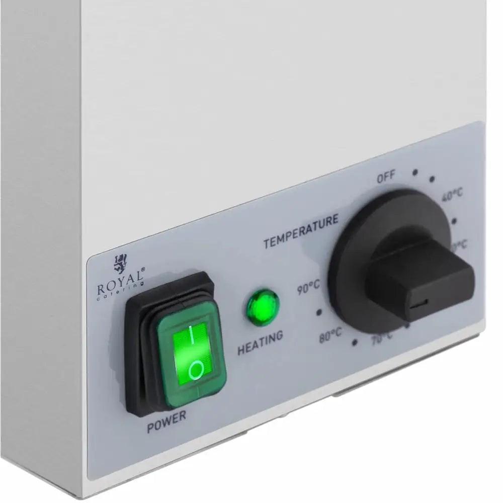 Varmeskap for sauser, nærbilde av kontrollpanel med grønn bryter, temperaturratt og indikatorlampe.