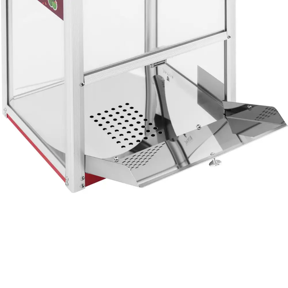 Varmevinduskåpe for nachos- og popcornvarmer, nærbilde av perforert stålplate og skrått uttaksbrett.
