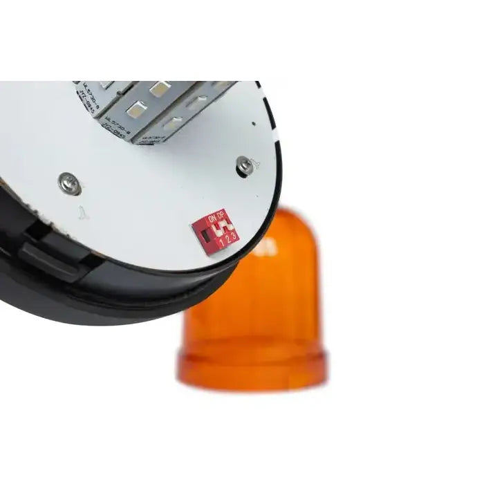 Varsellampe LED, underside med kretskort, DIP-bryter og LED, oransje kuppel synlig i bakgrunnen.