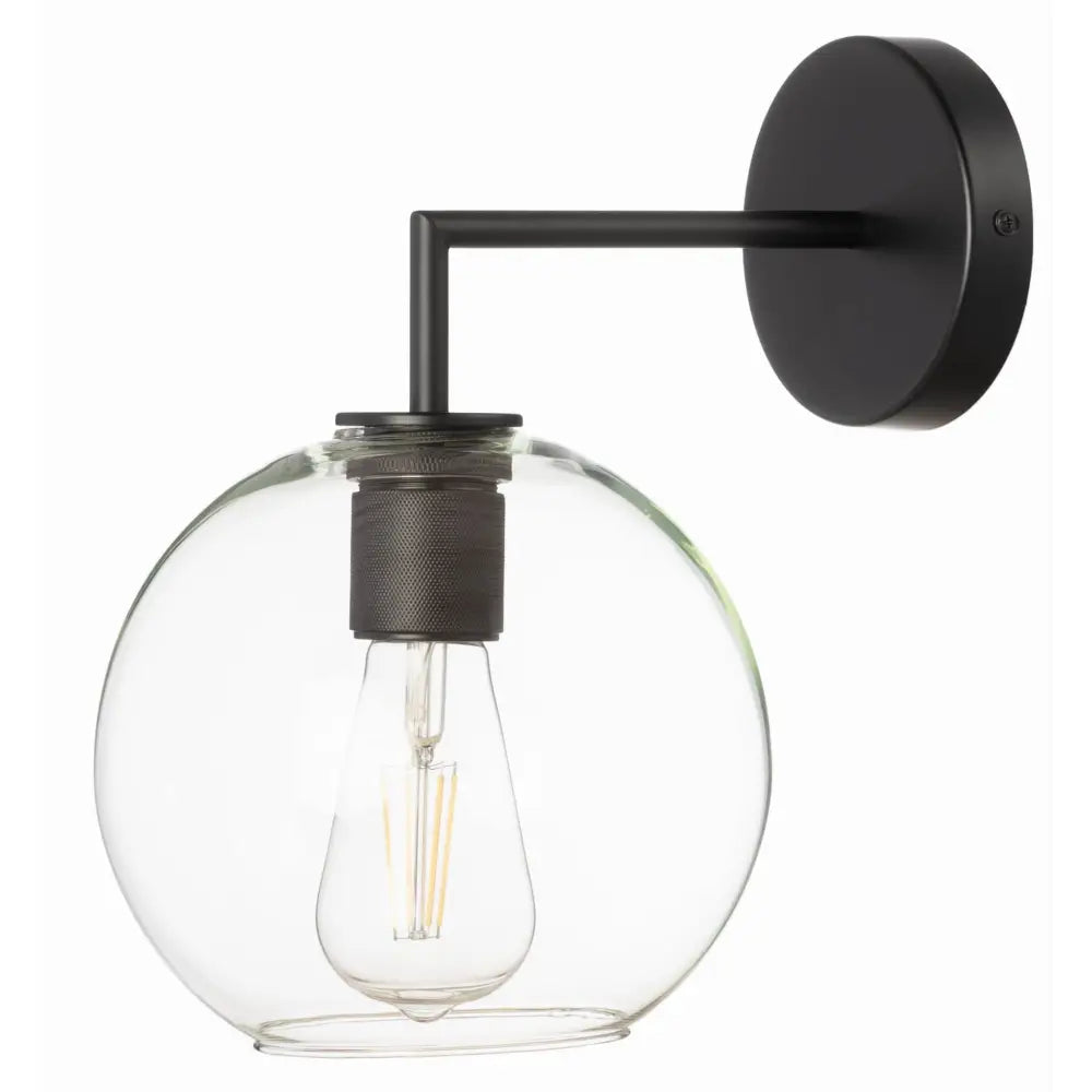 Vegglampe i svart metall med rund, klar glasskuppel og synlig lyspære, sidevisning med industrielt preg.