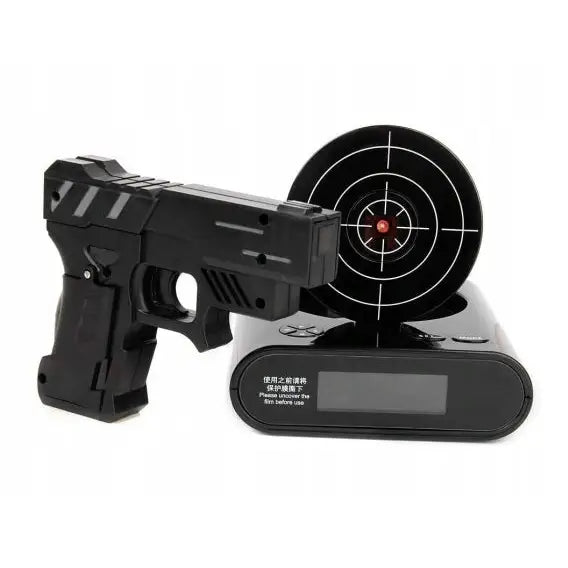 Vekkerklokke med skyteskive, sett forfra med pistol og digital base med blink og tydelig siktemål.