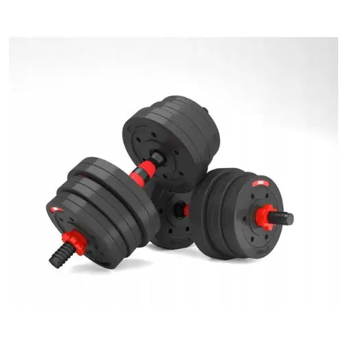 Vektsett med to svarte manualer, justerbare vektskiver og røde låser, sett i skrå vinkel.