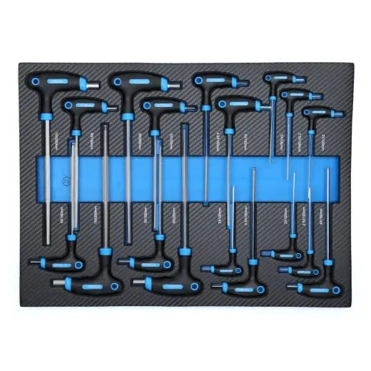 T-håndtak nøkler i ulike størrelser med svarte og blå grep, ordnet i skuminnsats, sett ovenfra.