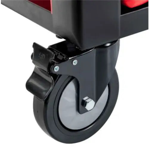 Verktøyvognhjul med grå kjerne og tydelig brems, sett fra siden montert i solid metallramme.