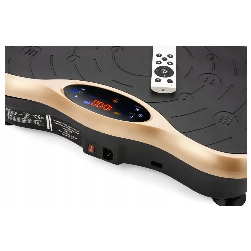 Vibrasjonsplattform Trening Massasjeren, nærbilde av det digitale displayet og kontrollpanelet i sort og gull.