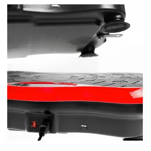 Vibrasjonsplattform, sidevisning som fremhever av/på-bryter, strømuttak og gummiknotter for stabilitet.