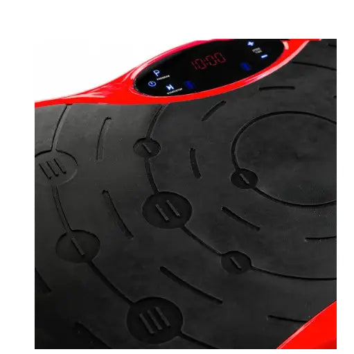 Massasjeapparat vibrasjonsplattform, nærbilde av teksturert sort plate med digitalt display og rødt deksel.