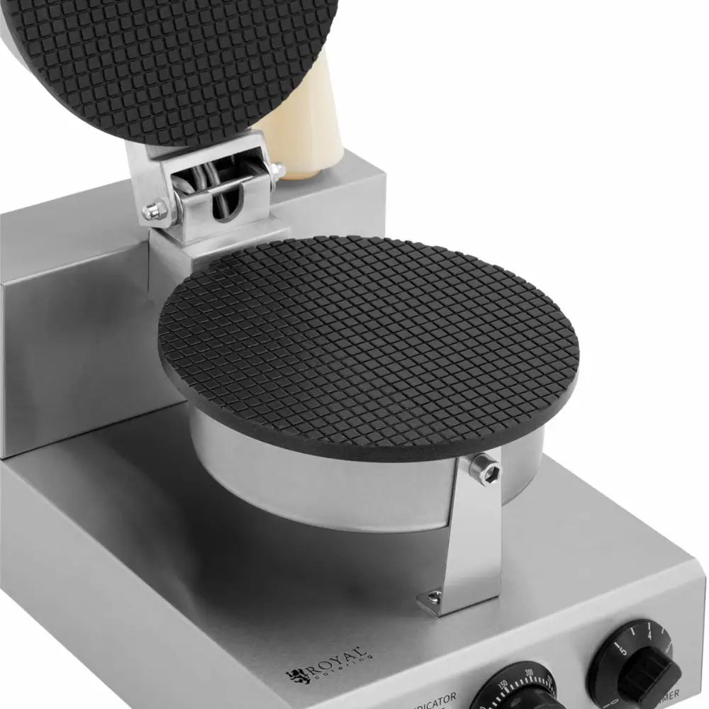 Wafeljern Vaffelkone med to runde varmeplater i rustfritt stål, nærbilde av rutemønster og frontkontroller.